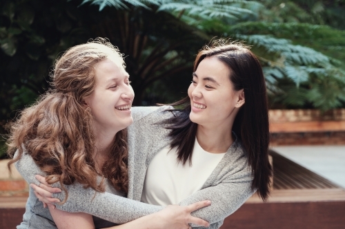 Happy students girl friends - Australian Stock Image