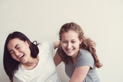 Happy students girl friends - Australian Stock Image