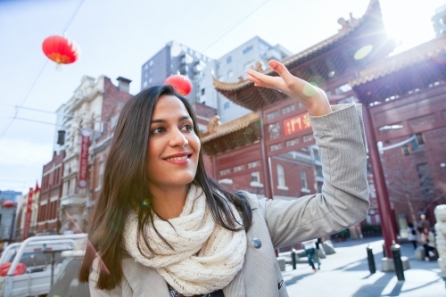 Happy Woman Exploring Chinatown - Australian Stock Image