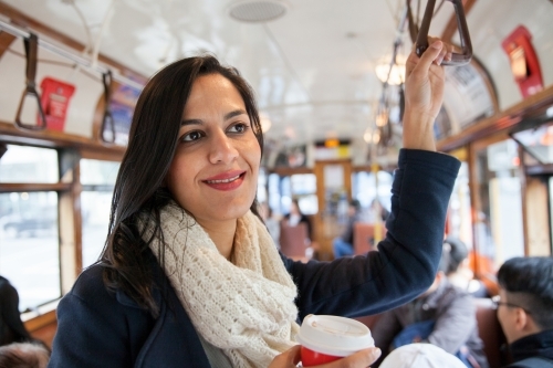 Happy woman travelling on the City Circle Tram - Australian Stock Image