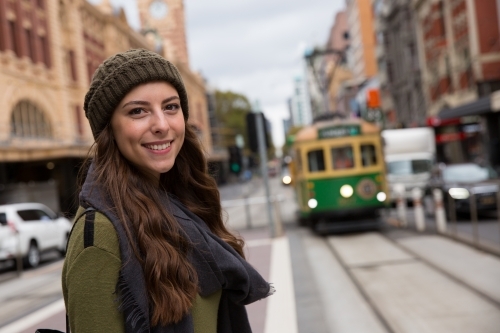 Happy Woman Waiting for Melbourne Tram - Australian Stock Image