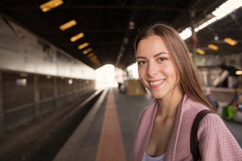 Happy Woman Waiting for the Train