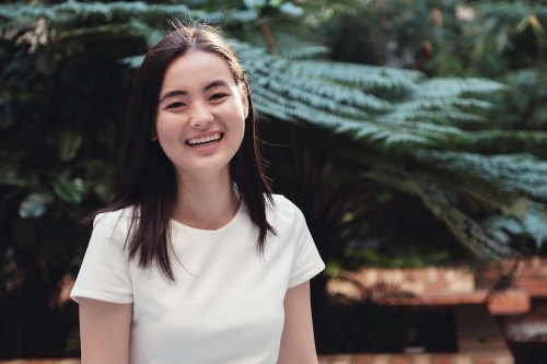 Happy young adult Asian student - Australian Stock Image