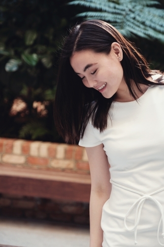 Happy young adult Asian student - Australian Stock Image