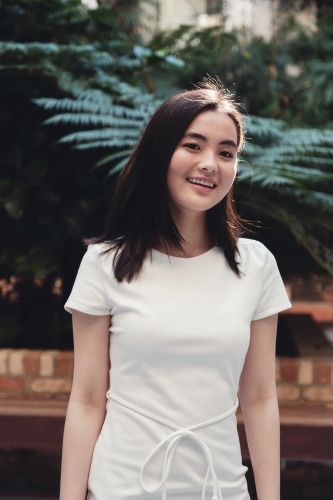 Happy young adult Asian student - Australian Stock Image