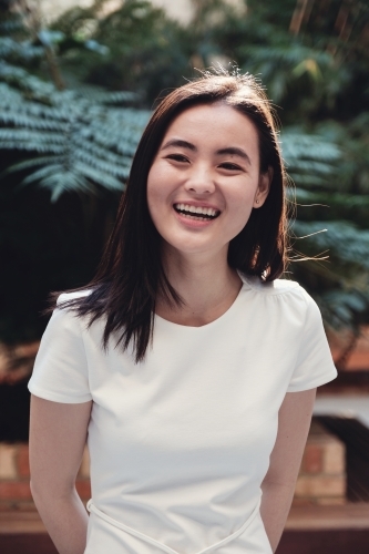 Happy young adult Asian student - Australian Stock Image