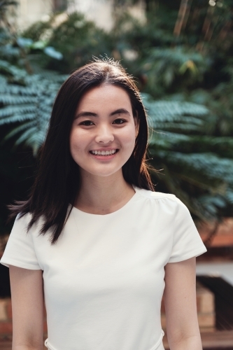 Happy young adult Asian student - Australian Stock Image