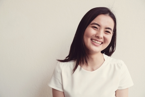 Happy young adult Asian student - Australian Stock Image