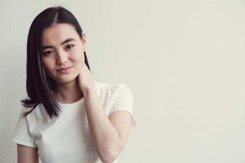 Happy young adult Asian student - Australian Stock Image
