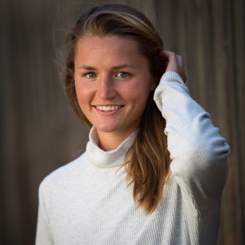Happy Young Woman holding her hair back - Australian Stock Image