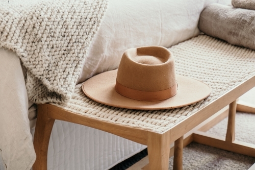 Hat sits on a bench seat - Australian Stock Image