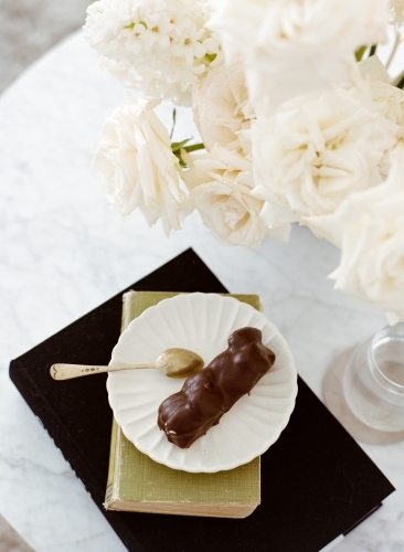 Having Afternoon Tea with Pastries and Roses - Australian Stock Image