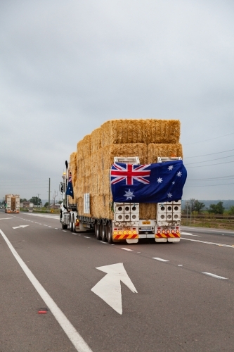 Hay in road train being transported across Australia to aid farmers in drought - Australian Stock Image