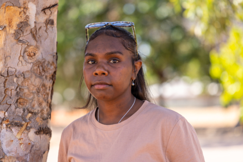 head and shoulders of young aboriginal woman with sunglasses on head in the Kimberley - Australian Stock Image