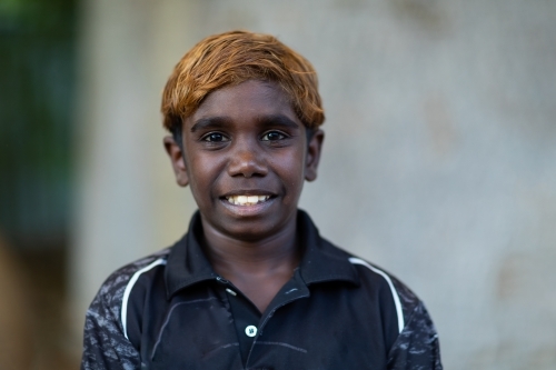 head and shoulders of young boy with dyed hair - Australian Stock Image
