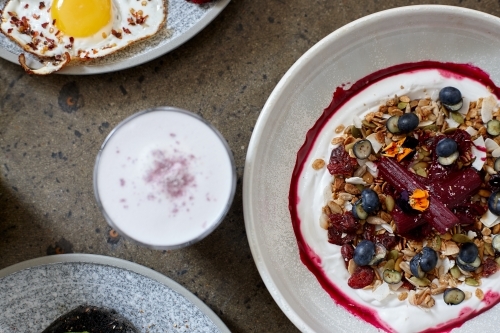 Healthy breakfast cereal with yoghurt and hot beverage