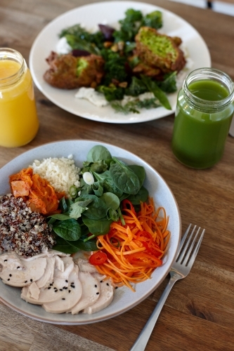 Healthy meals and juices on table - Australian Stock Image