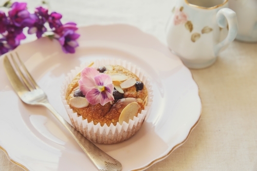 Healthy oatmeal cupcake on vintage plate - Australian Stock Image