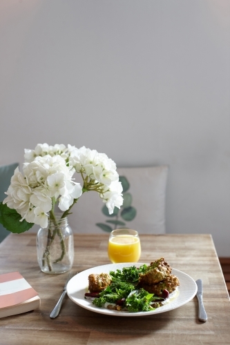 Healthy vegan meal on table of cafe - Australian Stock Image