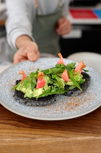 Healthy vegetarian meal being served on table - Australian Stock Image