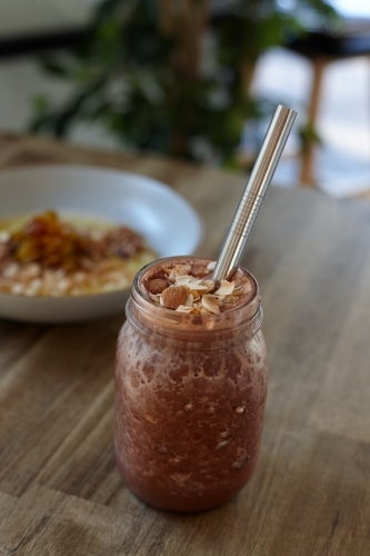 Healthy vegetarian smoothie on wooden table - Australian Stock Image