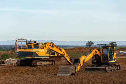 heavy earthmoving machinery on earthworks construction site for Singleton Bypass - Australian Stock Image