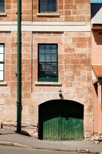 hewn sandstone facade of historic building - Australian Stock Image
