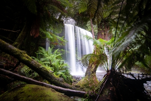 Hidden view of flowing waterfall. - Australian Stock Image