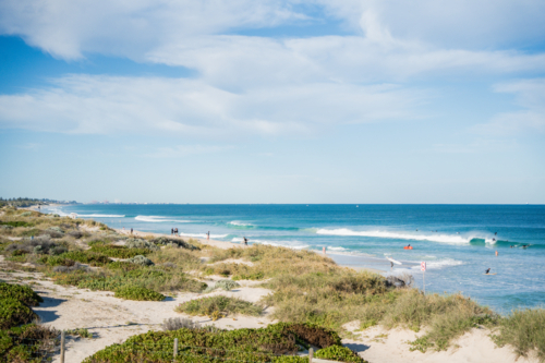 High angle elevated view of coastal sand dunes and turquoise ocean at Scarborough Beach, Perth - Australian Stock Image