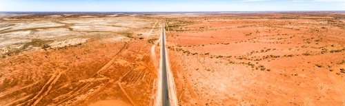 Highway cuts through western Queensland in drought. - Australian Stock Image