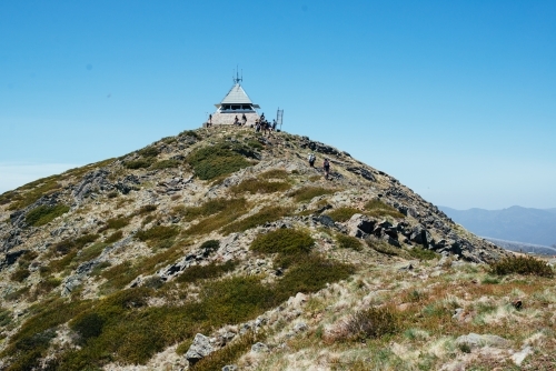 Hikers arriving at Mt Buller summit - Australian Stock Image