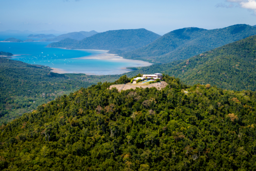 Hilltop house overlooking bays and forest near Airlie Beach - Australian Stock Image