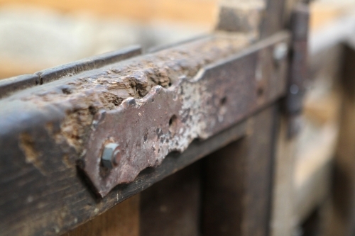 Hinge on gate in old woolshed - Australian Stock Image