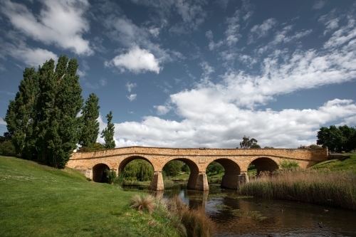 historic arch bridge over a river
