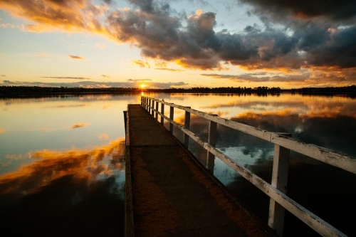 Historic jetty at sunset on Lake Towerrinning - Australian Stock Image
