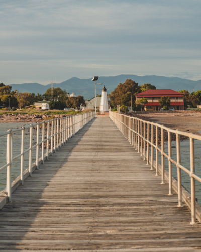Historic Port Germein Jetty with Flinders Ranges in the Background, South Australia - Australian Stock Image
