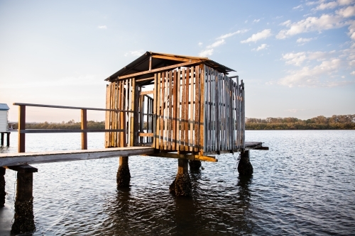 historical boat house on a river in Queensland - Australian Stock Image