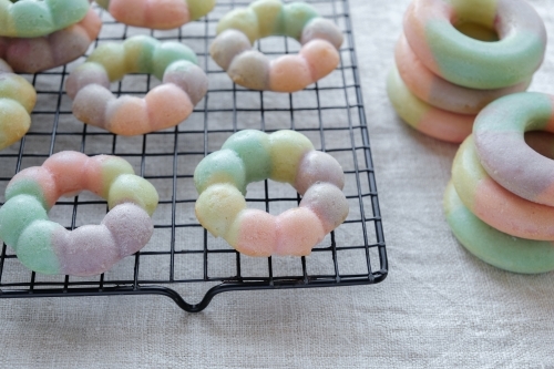 Homemade rainbow donuts - Australian Stock Image