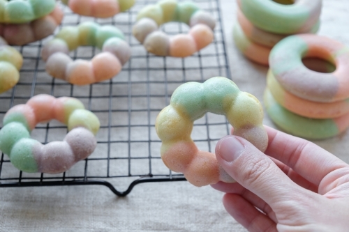 Homemade rainbow donuts - Australian Stock Image