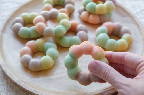 Homemade rainbow donuts - Australian Stock Image