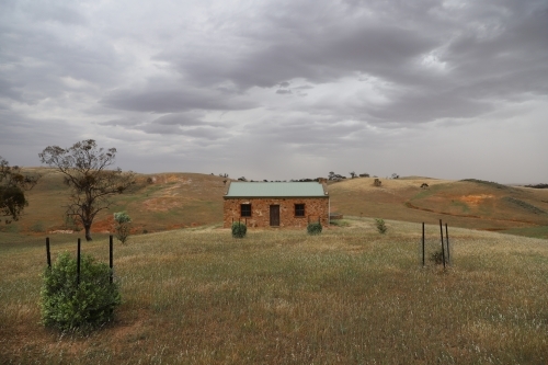 Lone brick house on a hilltop - Australian Stock Image