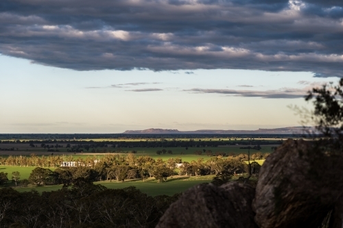 Horizontal shot of a farmland under a cloudy sky - Australian Stock Image