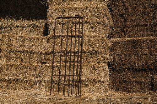 Horizontal shot of a Hay Bales stored in a shed on rural property - Australian Stock Image