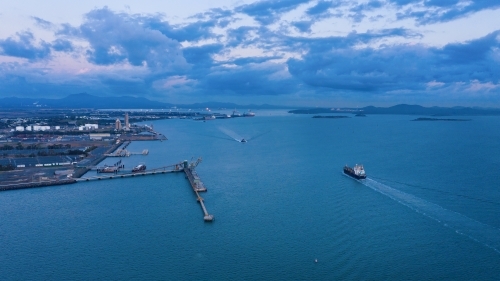 Horizontal shot of a port and ships sailing - Australian Stock Image
