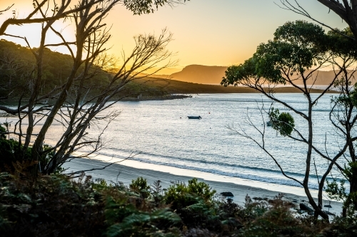 Horizontal shot of a serene sunset sky by the beach - Australian Stock Image