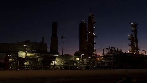 Horizontal shot of an industrial plant at night