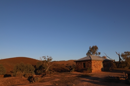 Horizontal shot of an old abandoned house on the hill top - Australian Stock Image