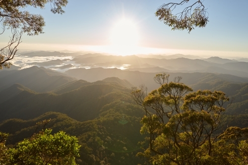 Horizontal shot of mountain tops at sunrise - Australian Stock Image