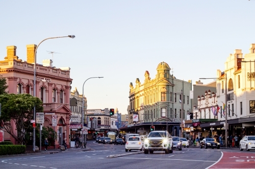 Horizontal shot of Newtown's street with buildings and cars