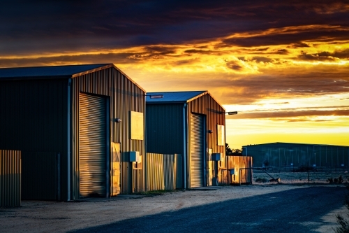 Horizontal shot of two garage sheds at sunlight - Australian Stock Image